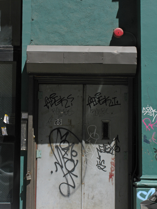 graffiti on TriBeCa entrance doors, Manhattan, NYC