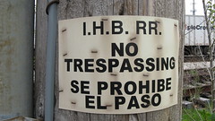 Indiana Harbor Belt Railroad Bilingual no trespassing sign. Broadview Illinois. Early May 2009.