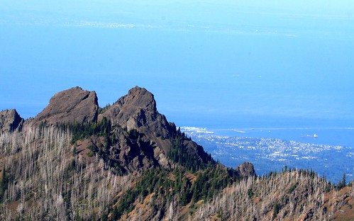 Denuded mountains in Olympic National Park, Port Angeles, and Victoria B.C. way in the distance