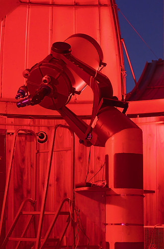 Celestron C-14 Schmidt Cassegrain telescope at the Richard D. Schwartz Observatory at the University of Missouri - Saint Louis, in Normandy, Missouri, USA - view with red lighting