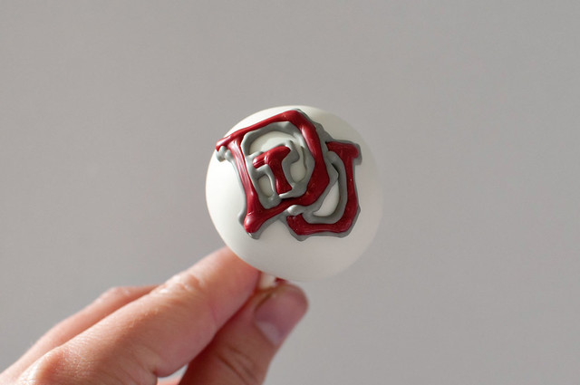 Denver University logo groom cake pops