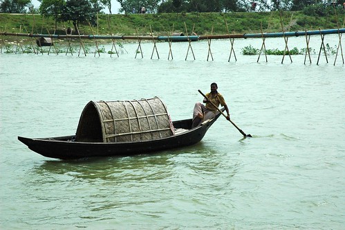 Happy Boatman on the river near Dhaka Bangladesh by Wonderlane