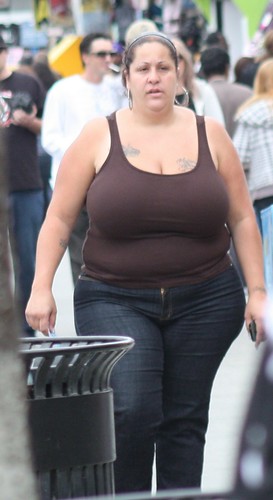 Big beautiful woman in Jeans and top showing her tattoos