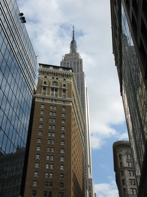 a view from 33rd Street in Manhattan includes the Empire State Building, NYC