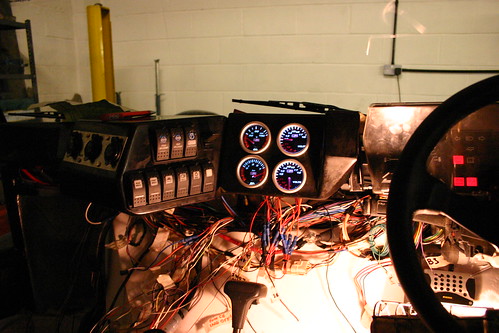 Dashboard wiring. On the left are three cigarette-lighter style power sockets.