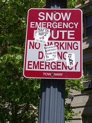 Street sign with protest stickers, 13th and Massachusetts Avenue NW