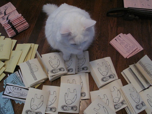 Nilla helping me cut and staple zines.