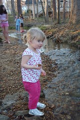 Catie throwing rocks in the creek