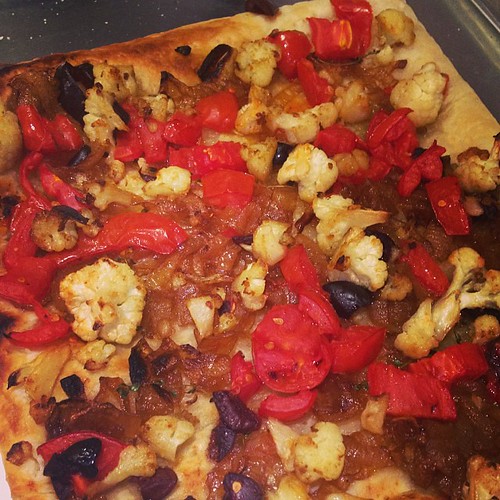 Vegetable pastry with cauliflower, tomatoes, onions, and olives.