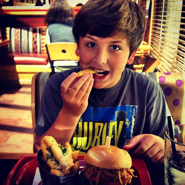 #Bday boy Elijah is slightly concerned after I told him the new #Wolverine burger has real wolf meat in it! #Yummmm