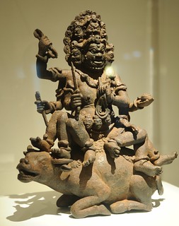 From http://www.flickr.com/photos/71401718@N00/10578893433/: Yamantaka, Fear-Striking Vajra, Lord of Death (Tibetan:  Gshin-rje-gshed), multiheaded, holding vajra, rope, dagger, riding a water buffalo, statue of a guardian, enormous strength, Tibetan Esoteric Buddhism, Art Institute, Chicago, Illinois, USA