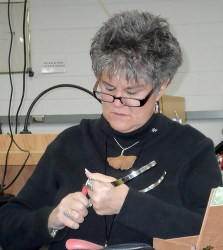 Jane Davis works on a necklace at Joliet Junior College.