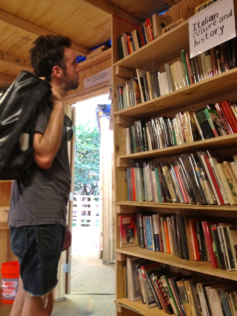: Yoni checks out the books available in the library