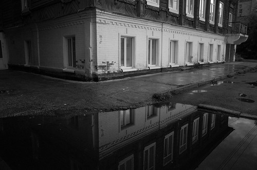 House and its puddle ©  Tony