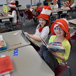Elementary students pose in Cat in the Hat hats
