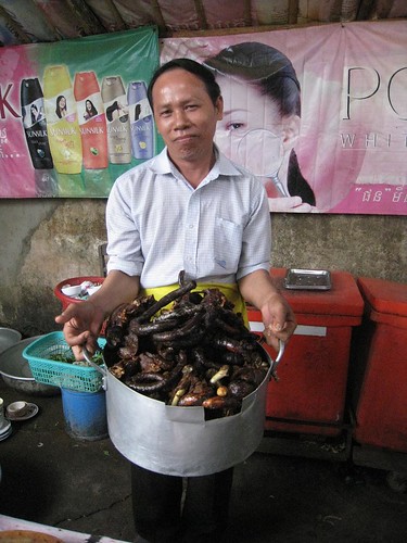 The chef/owner proudly displays his restaurant's dog meat