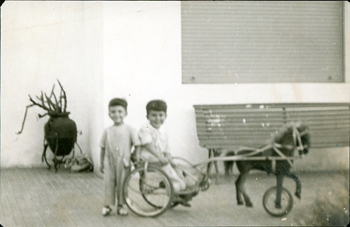 Two boys and a riding toy