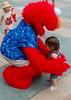 a hug from her buddy Elmo - she was in shock!
