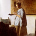 WOMAN IN BLUE READING A LETTER