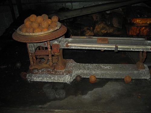 Rusted weights on a rusted beam balance