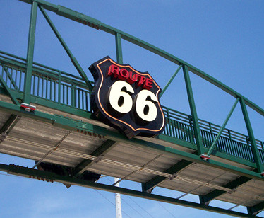 The Route 66 shield at the Cyrus Avery Route 66 Memorial Plaza overpass in May 2008, before it was vandalized.