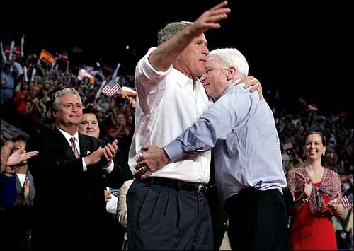 Senator John McCain and President George W. Bush embracing in a very intimate hug...not that there is anything wrong with that.