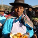 Woman serving us lunch at celebration in Huyuculano