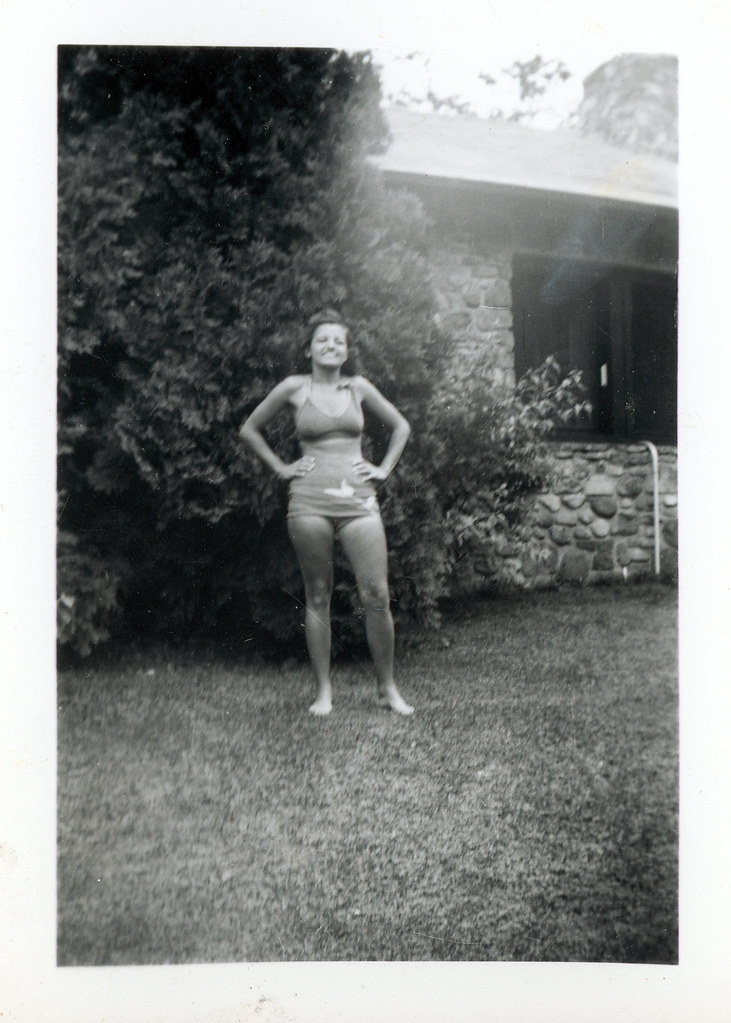 Hollie in bathing suit standing in front yard