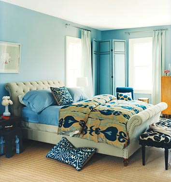 Bedroom pattern mix: Blue + green ikat fabric + upholstered headboard