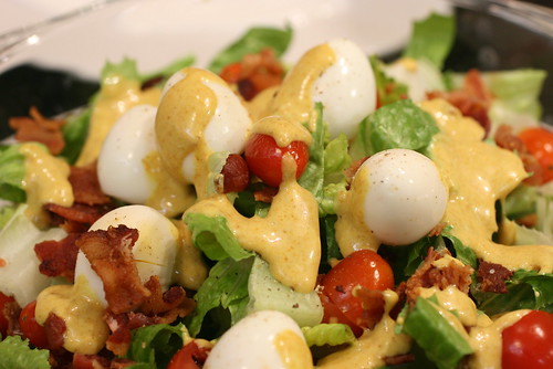 quail egg and bacon salad with creamy curry dressing