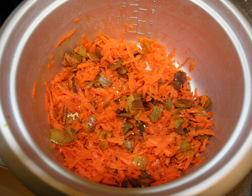 Add onion mixture, carrots, orange peel, and salt to your rice cooker.