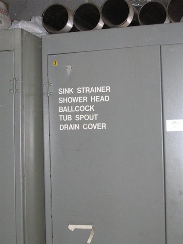 Plumbing parts storage cabinet