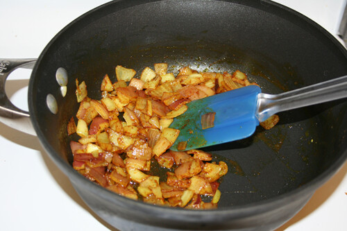 Add the turmeric, cinnamon, and cardamom to the onions
