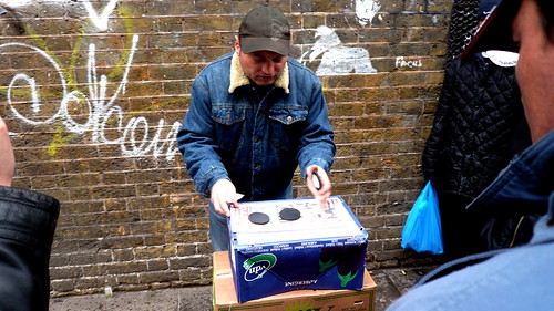 Con artist throwing monte (with suckers), Brick Lane, London, UK 2.JPG