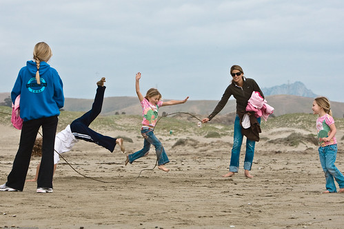 Kids play skiprope on Morro Strand State Beach - Wholesome Family Scene