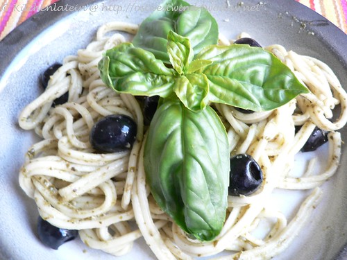 Spaghetti with basil pesto and olives