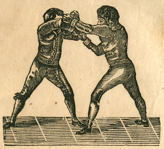 Anglų lietuvių žodynas. Žodis prize-fight reiškia prizas-kova lietuviškai.