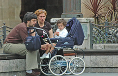Parents and child in Bilbao Square by john.fisch