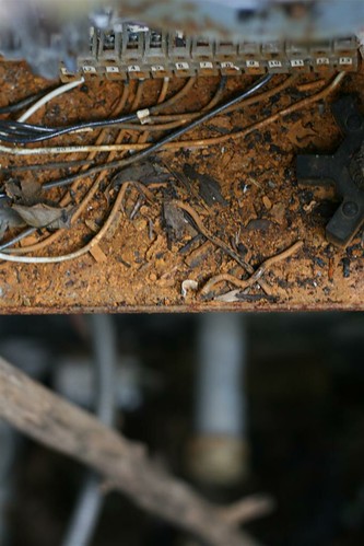 Rust and electrical wires in the utility shed