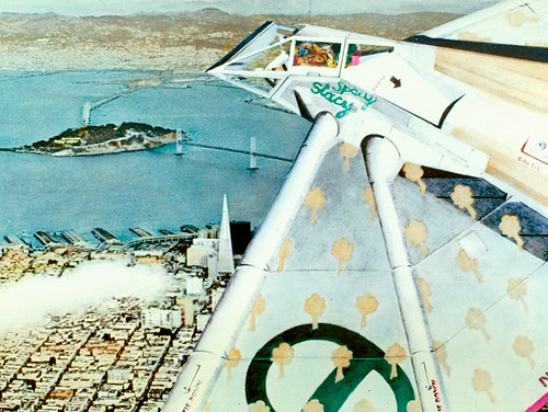 An ecotopian fighter plane with tensile hang-glider wings on hydraulic fingers, husband-and-wife teams in the cockpit, and composite construction of titanium and bamboo with teflon-coated fiberglass wings.