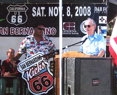 From left, San Bernardino Mayor Pat Morris, Danny Castro and Bob Lundy present one of the Kicks on 66 signs.