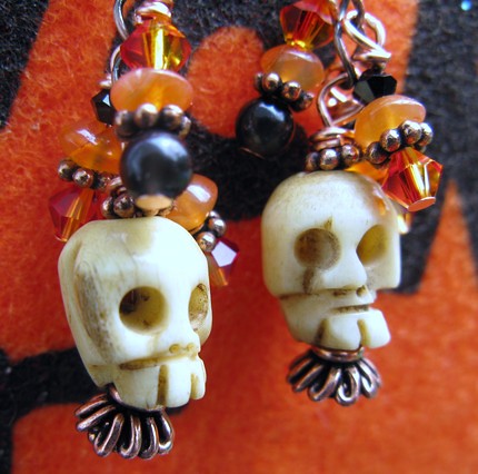 ..SOLD AND SHIPPED TO ENGLAND..SpOOKy Carved Skull BONE Dangle EaRrIngs with Black Onyx, Carnelian, swarovski crystals, perfect FOR HALLOWEEN..$15.00 on Etsy