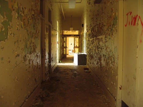 Peeling paint in the infirmary hallway