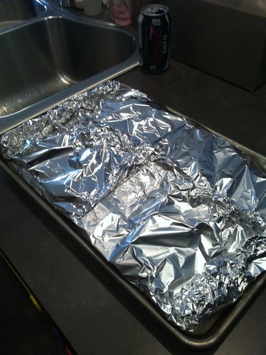 Slow roasted ribs wrapped in foil and ready to cook