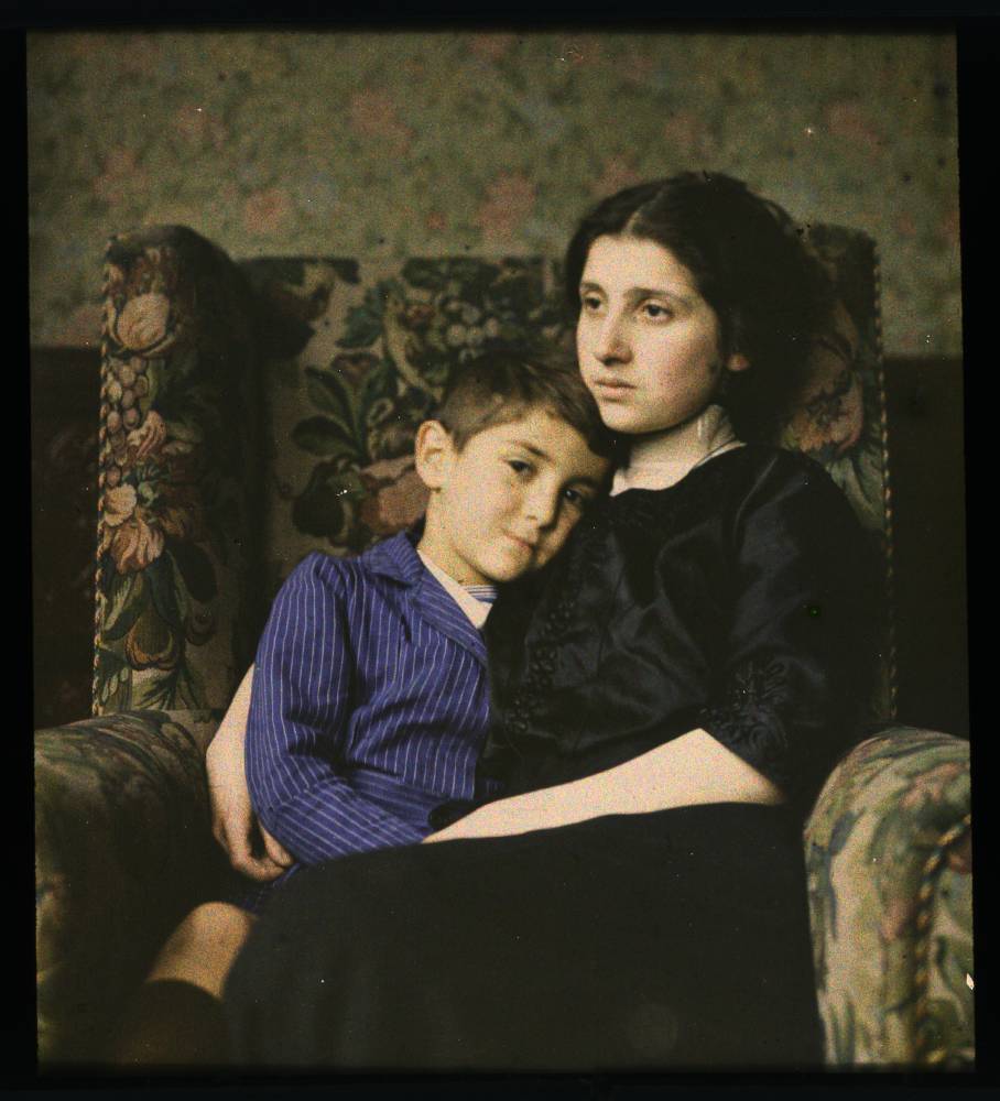 Woman and boy sitting in chair