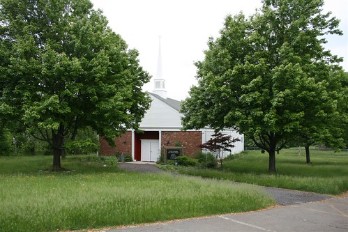 Semi-active church building with uncut grass