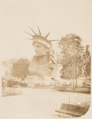 [Head of the Statue of Liberty on display in a park in Paris...