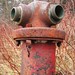 Old rusted fire hydrant missing caps