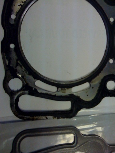 A Failed 2.5l Head Gasket Next To A New One