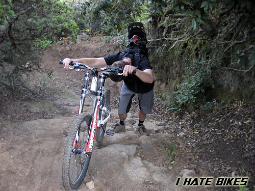 Eric Dimmick pushes his bike up the trail known as the Crack. Photo: Jason Van Horn